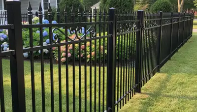 Black metal ornamental fence installation by Chop Chop Landscaping in Saugus, MA enhancing curb appeal